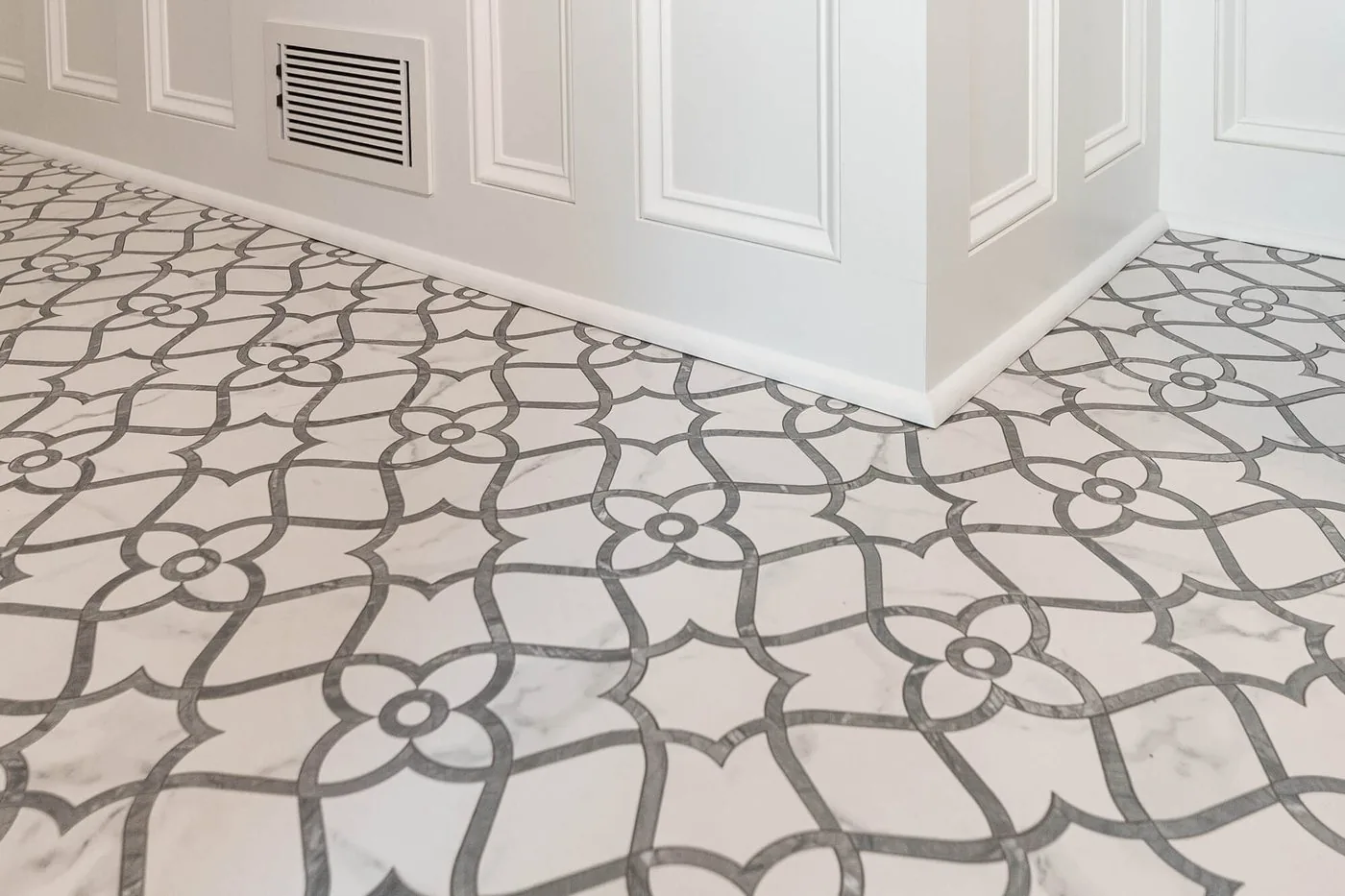Patterned stone floor running the length of a hallway