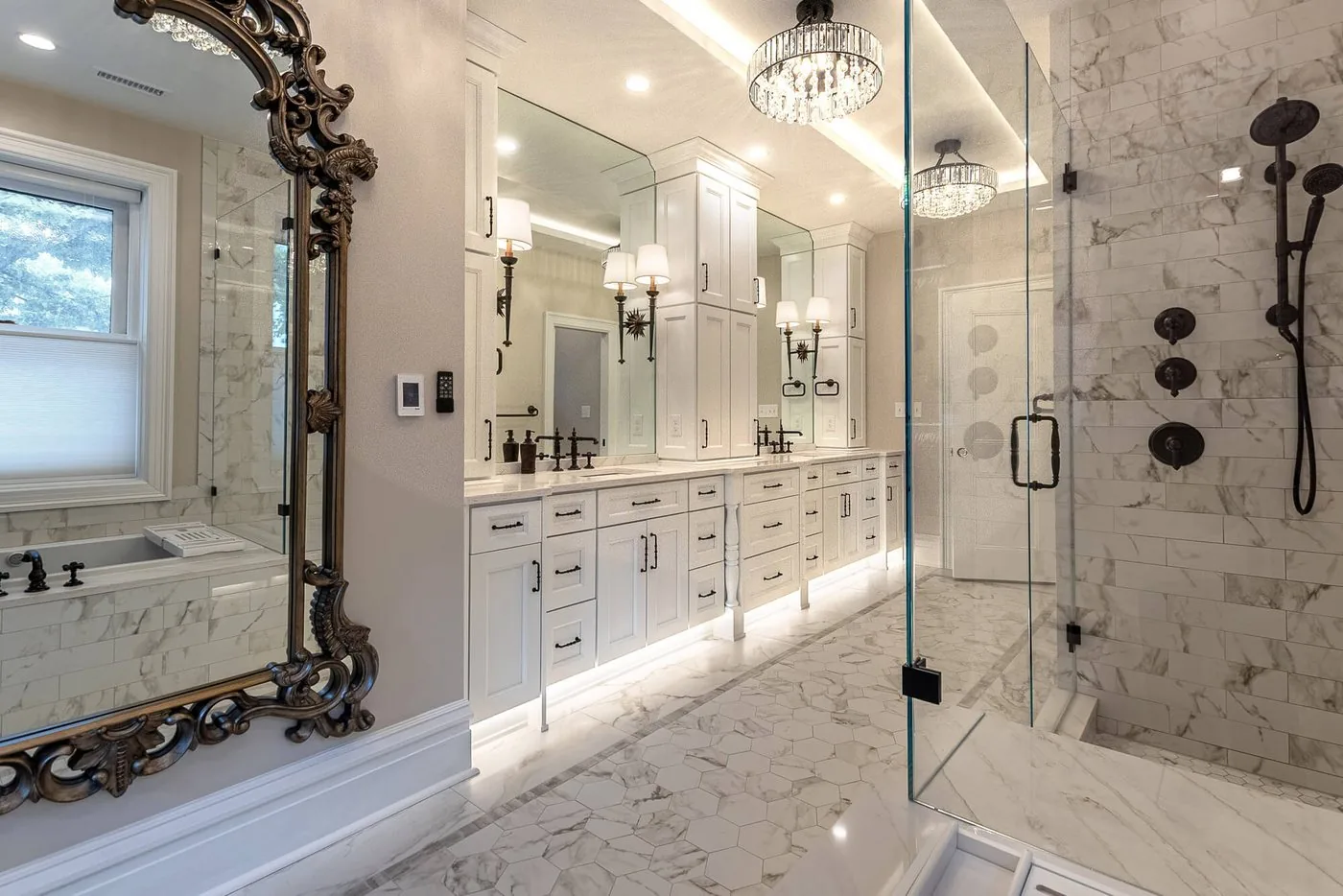 Bathroom with a marble vanity and an ornate mirror