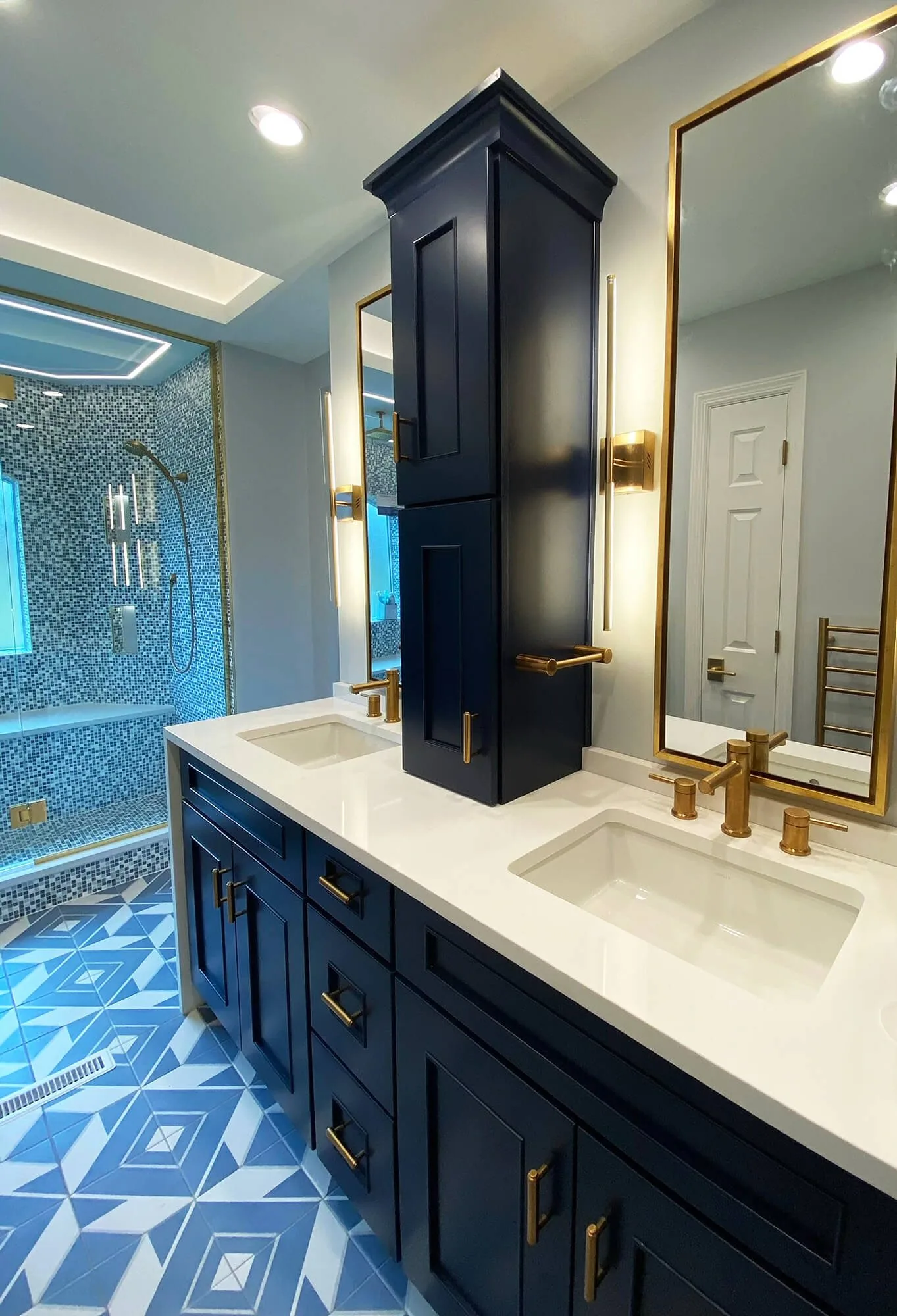 Bathroom with a painted vanity and patterned floor tile