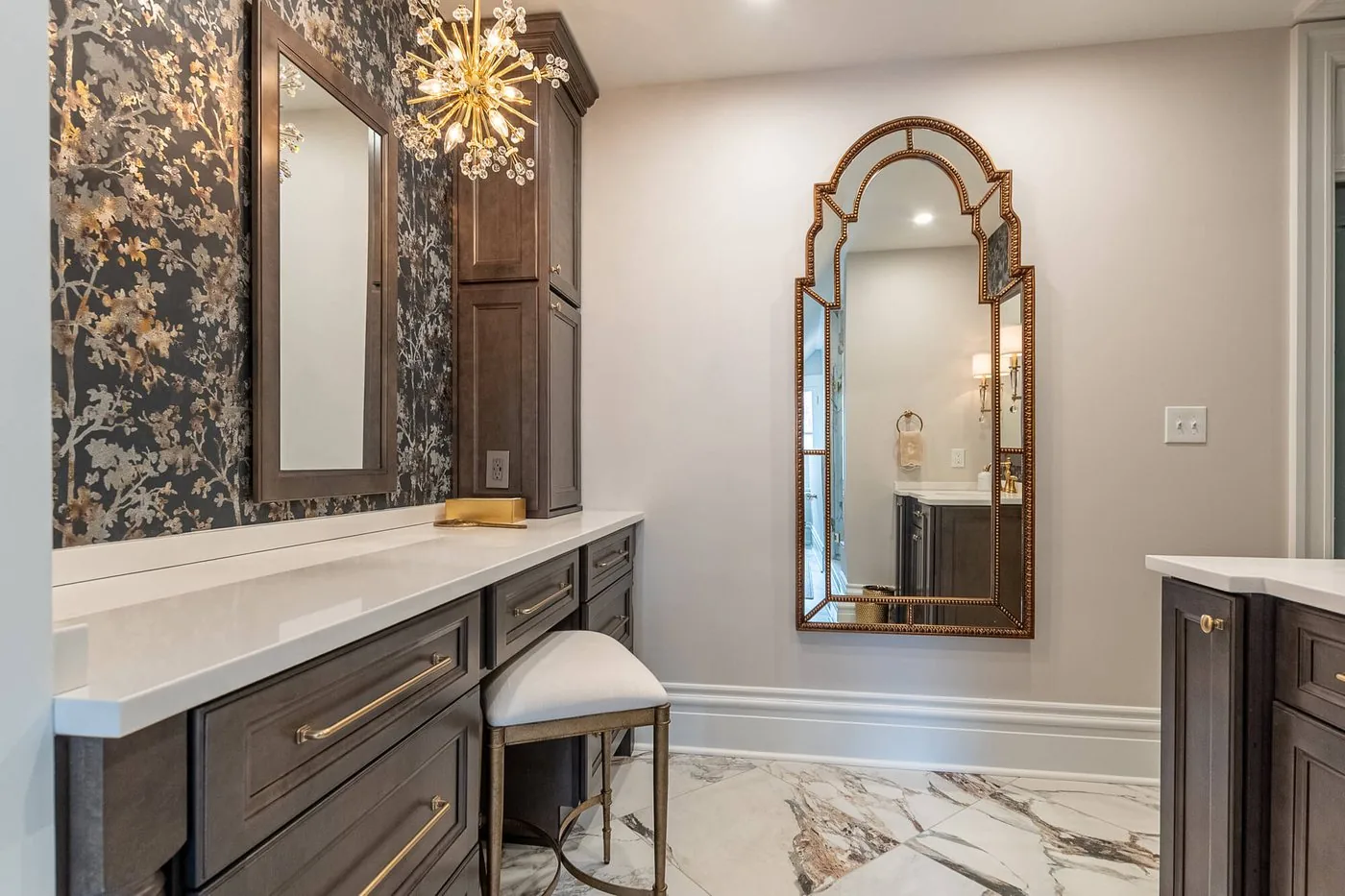 Double vanity with mirrors and wall sconces