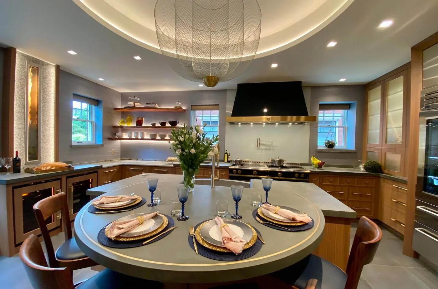 Kitchen with a round table and brass pendants