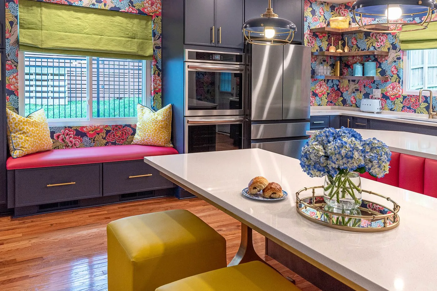 Kitchen with patterned wallpaper and green tile