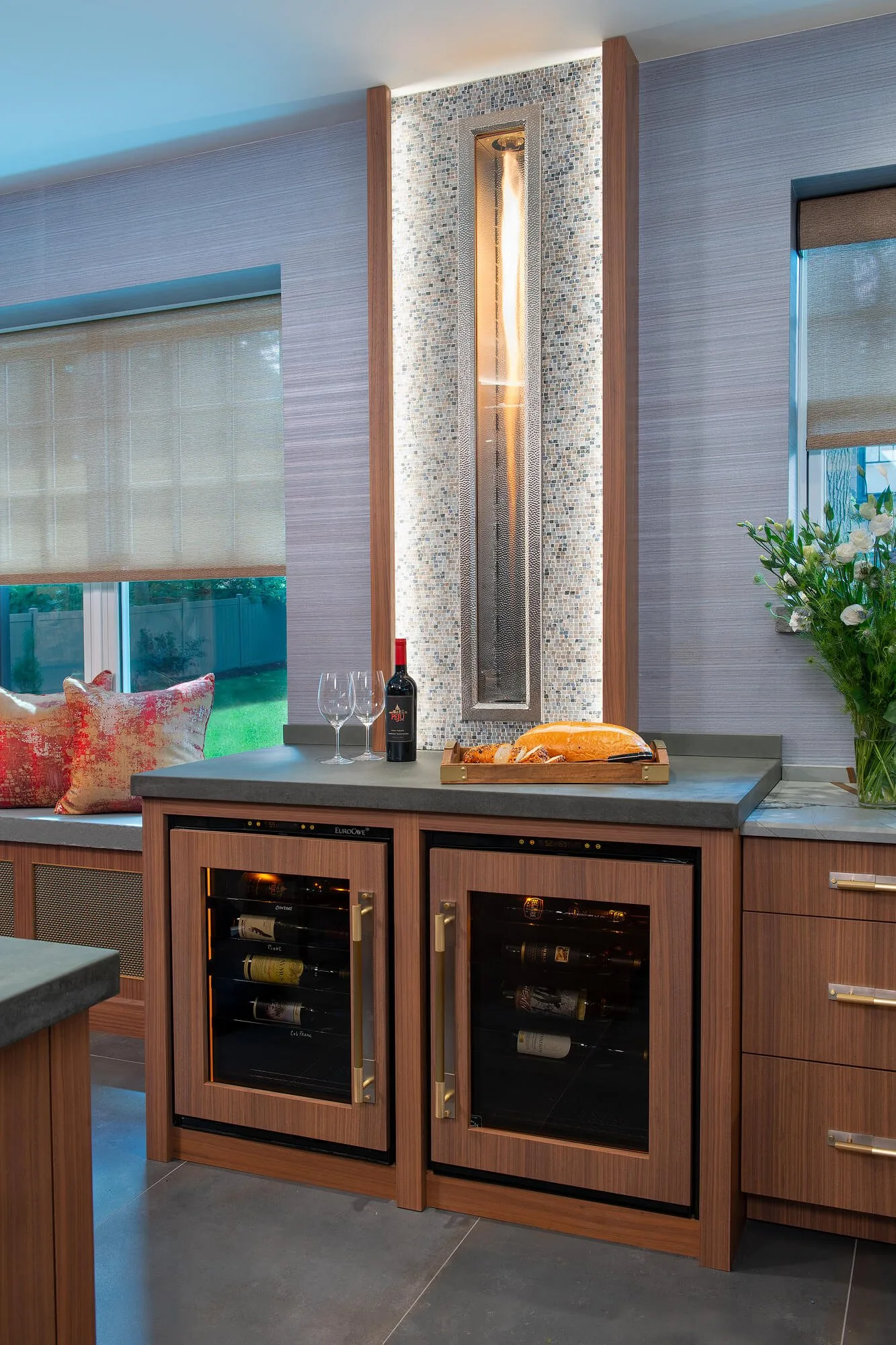 Kitchen island with counter stools and a marble top
