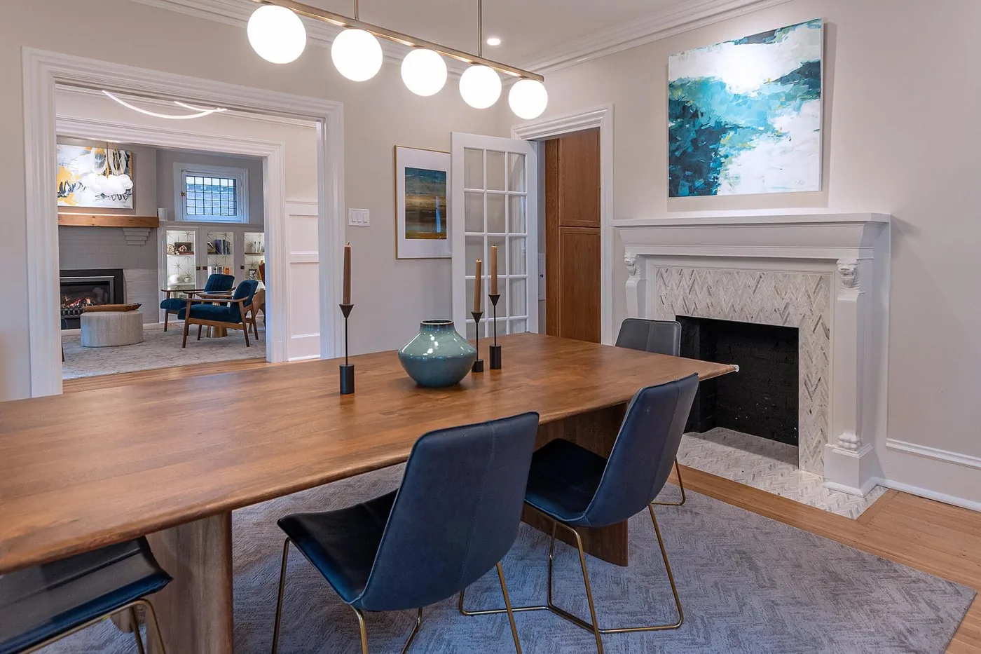 Dining room with a fireplace and long wood table