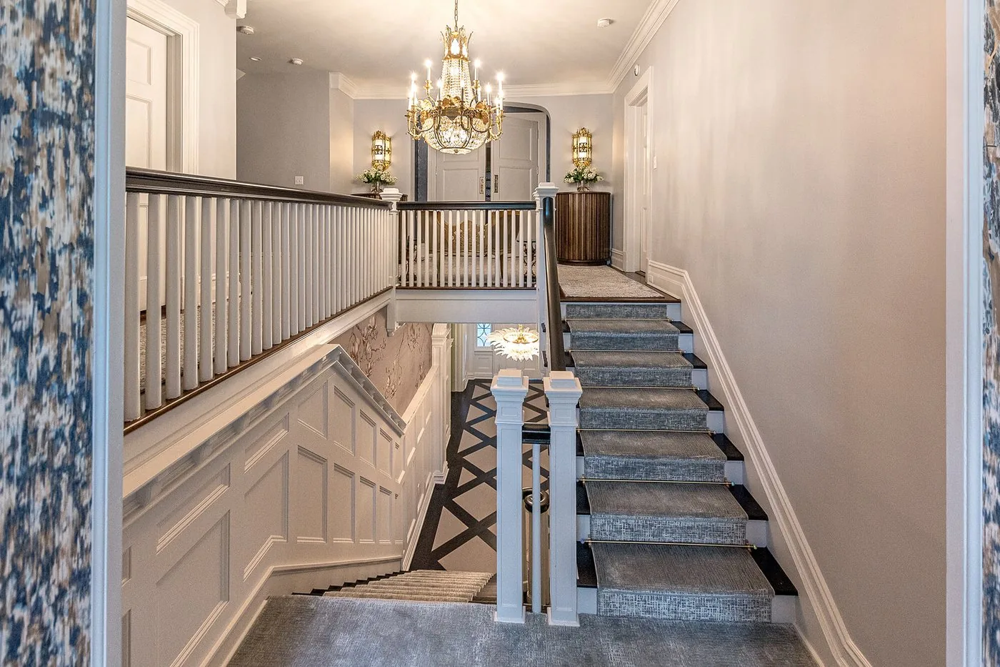 Stair with a painted balustrade under a hanging light